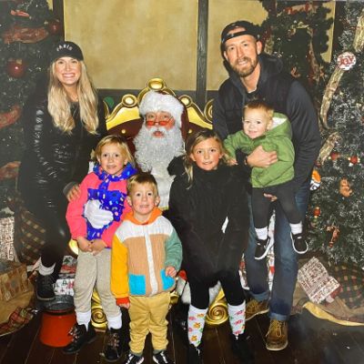 The picture shows Ryan Walters with his wife, four kids, and a Santa.